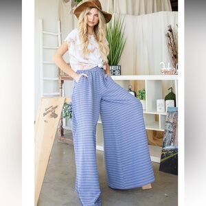 160. Multi printed smocked waist wide leg pants with pockets on blue